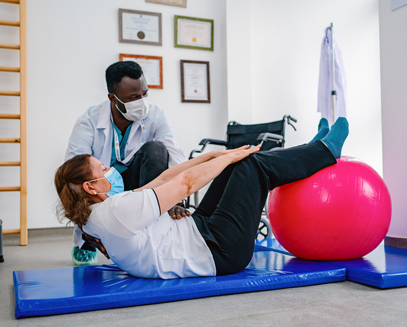 Physical therapist providing chronic pain management and rehabilitation