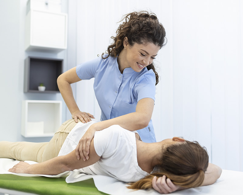 Physical therapist providing hip pain treatment and joint rehabilitation