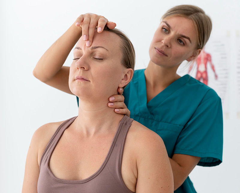 Physical therapist providing neck pain treatment and cervical care